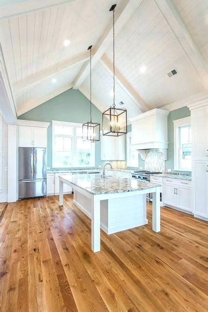 Plus, the extra wall space created means more room for extended windows, transom windows, and even skylights—hello, natural light. Image result for pendants lights over island vaulted ...