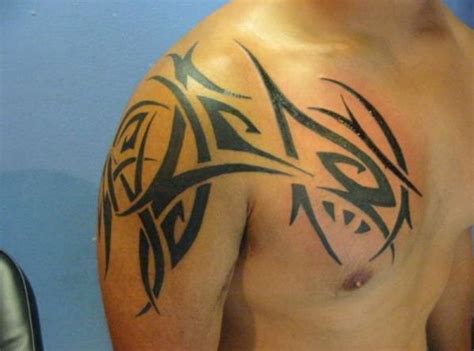 17 Powerful Shoulder Tattoos For Men Tribal Shoulder Tattoos Mens