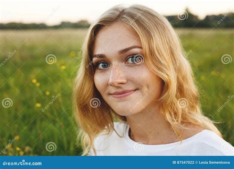 A Portrait Of Beautiful Young Blue Eyed Girl With Light Hair Having
