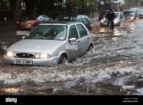 Heavy Rain Causes Flash Flooding In Stoke Newington London Traffic