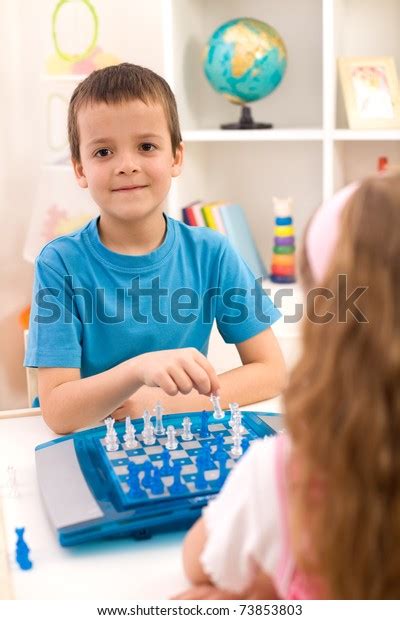 Kids Playing Chess Sitting Table Their Stock Photo 73853803 Shutterstock