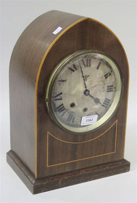 An Early 20th Century German Mahogany Mantel Clock With Eight Day Chiming Movement The Silvered Cir
