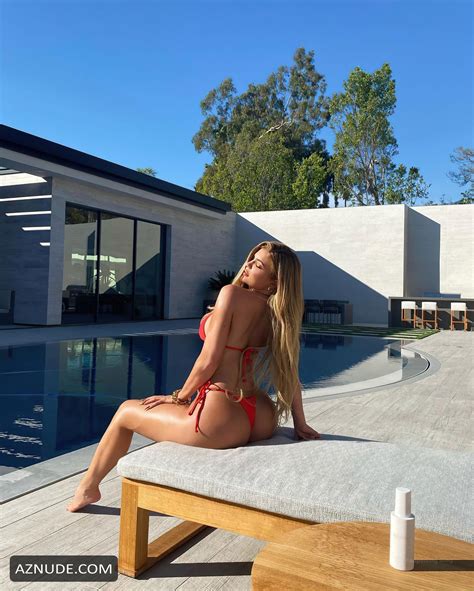 Kylie Jenner Flaunts Poses In A Red Bikini Poolside AZNude