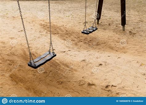 Some Swings In The Schoolyard Closeup Photo Stock Photo Image Of