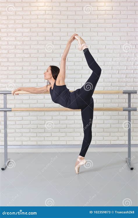 Ballerina Stretches Herself Near Barre At Ballet Studio Beautiful