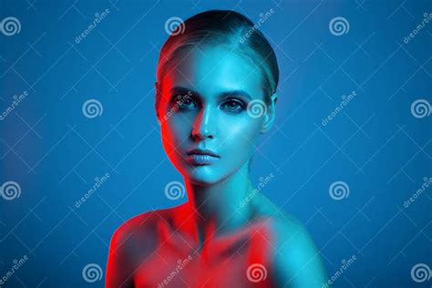 Fashion Art Portrait Of Beautiful Woman Face Red And Blue Light Stock