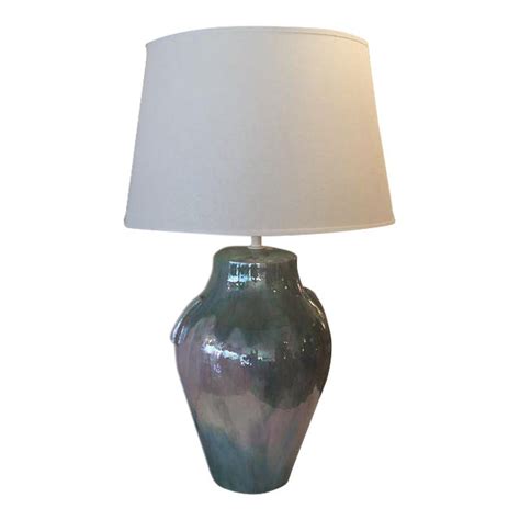 It's made from a single metal rod that is curved to create an warm and charming, this contemporary oval table lamp features a soft ombre pink glass urn base on a mounted oval crystal base. Iridescent Green & Pink Table Lamp | Chairish