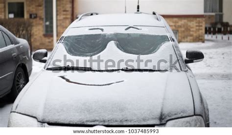 Funny Face On Snow Covered Cars Stock Photo Edit Now 1037485993
