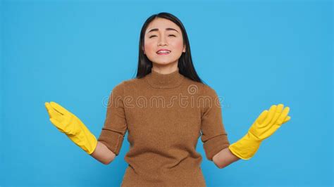 Happy Asian Maid Being Happy About Finishing House Cleaning Stock Image