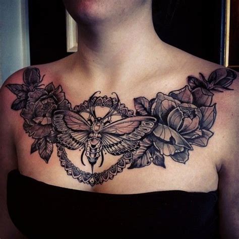 .a nice chest tattoo for women, it has a rose between which symbolizes emotions. 50 Beautiful Tattoos Specially Designed For Female - Yo Tattoo