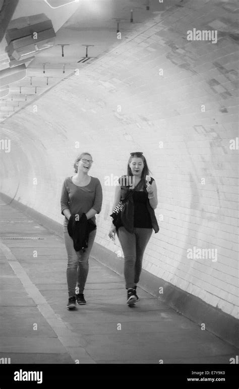 Two Young Women Walking Through Greenwich Foot Tunnel That Runs Under