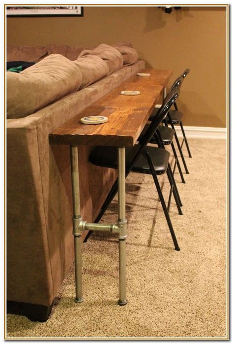 This enables the table to be used as a dining table as well as allows you to pull out extra chairs when you have guests. bar table behind couch - Google Search | Bar table behind ...