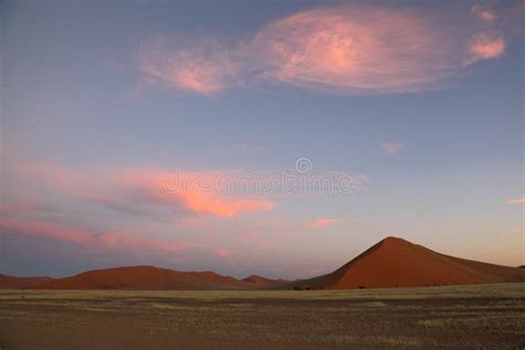 Puffy Pink Clouds Over Red Sand Dunes Stock Photo Image Of Sossusvlei