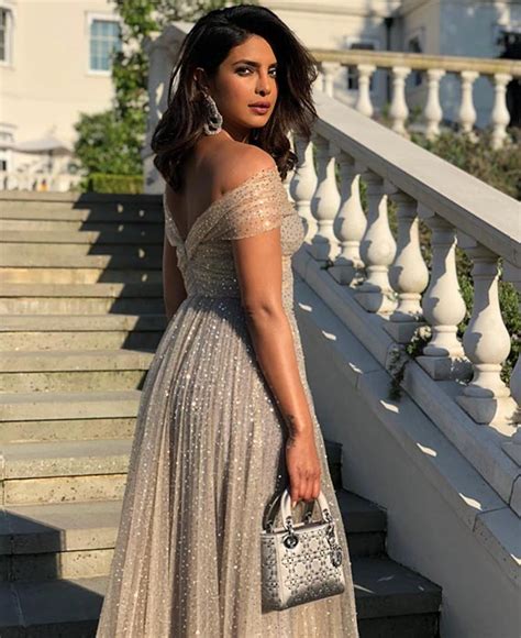 Priyanka Chopra Shines In A Golden Dior Dress At The Royal Wedding