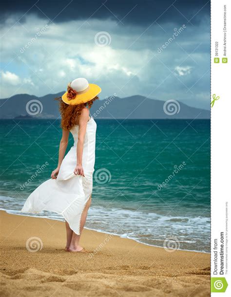 Lonely Woman In A White Dress Standing At The Sea Stock Photo Image