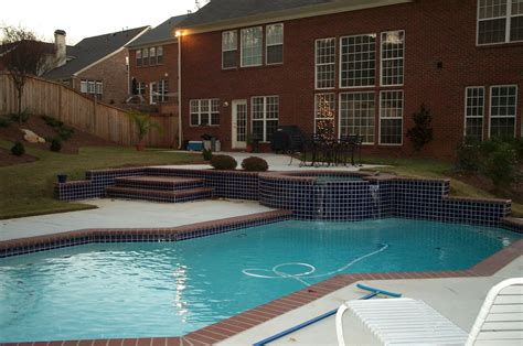 Geometric Pool With Tile Accents And Brick Coping Anthony And Sylvan Pools