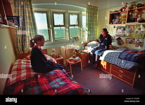 Two Roedean Schoolgirl Pupils Chat In Their Boarding School Dormitory