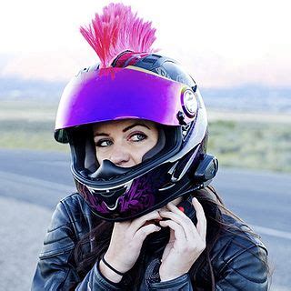 Girl Fastening Motorcycle Helmet With Hot Pink Mohawk Motorcycle