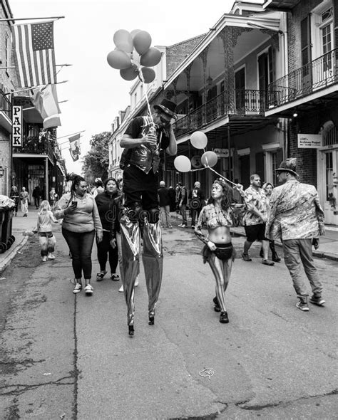 Man On Stilts Walking Through The Street Mardi Gras Day In The French
