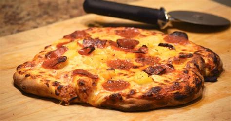 In a large bowl, dissolve sugar and salt in water. New York Style Pizza Dough - Indiana Mommy - Cooking From ...
