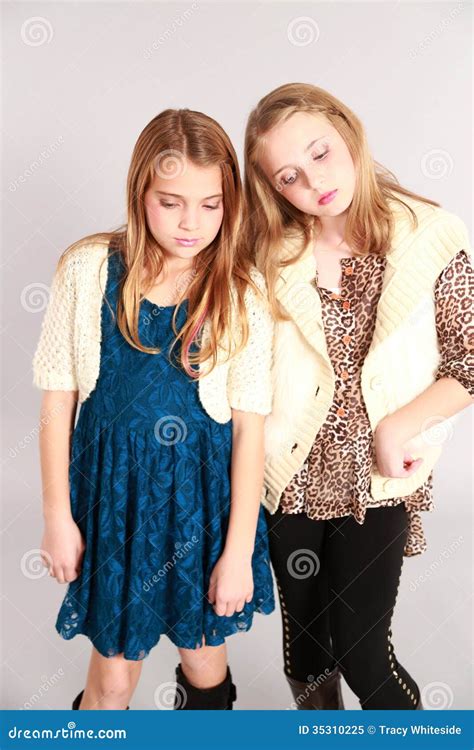 Two Little Blonde Girls Looking Down Stock Image Image Of Fashion