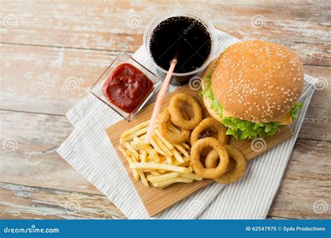 Close Up Of Fast Food Snacks And Drink On Table Stock Image Image Of