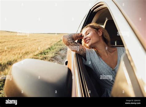 Happy Tattooed Girl Enjoying Road Trip Young Woman Relaxing And