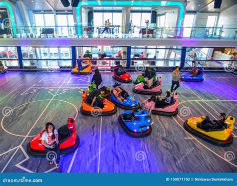 People Ride In Bumper Car At Amusement Park Editorial Photography