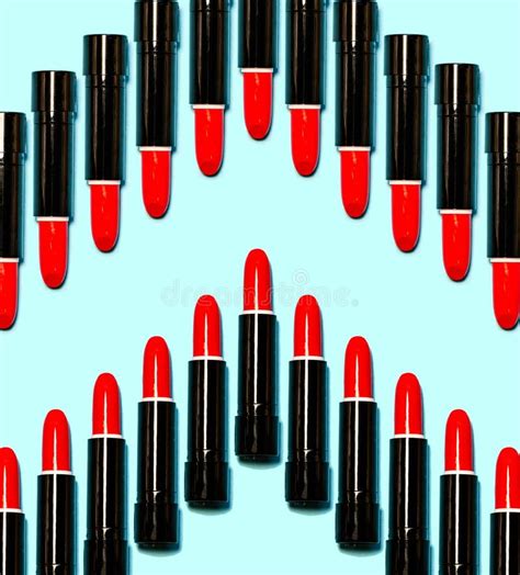 Set Of Red Lipsticks Isolated On Blue Color Background Stock Photo