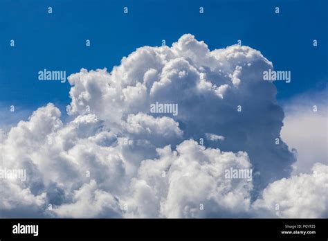 Formation Of Storm Clouds Shapes Fluffy White Cumulus Clouds In Blue