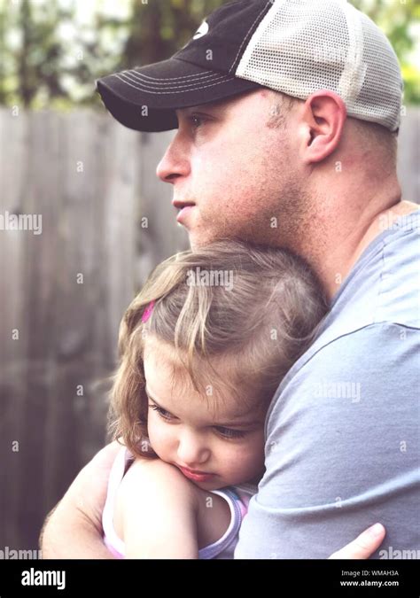 Close Up Of Father Embracing Daughter At Yard Stock Photo Alamy