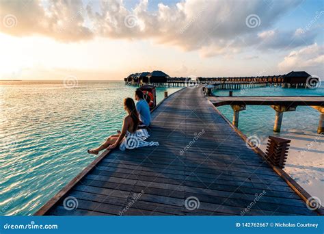 A Couple Enjoying A Sunrise In The Maldives Stock Image Image Of Resort Attractive