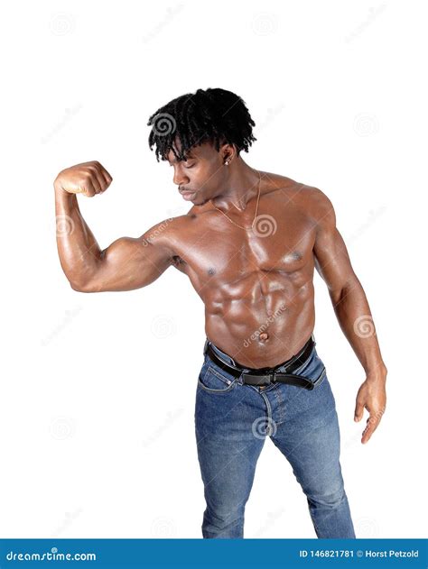 African Man Flexing His Biceps And Looking On It Stock Image Image Of