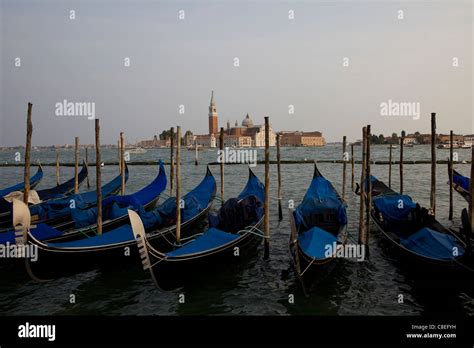 Gondolas And Cathedral San Giorgio Maggiore Stock Photo Alamy