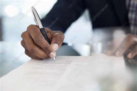 Businessman Signing Paperwork Stock Image F0099972 Science Photo