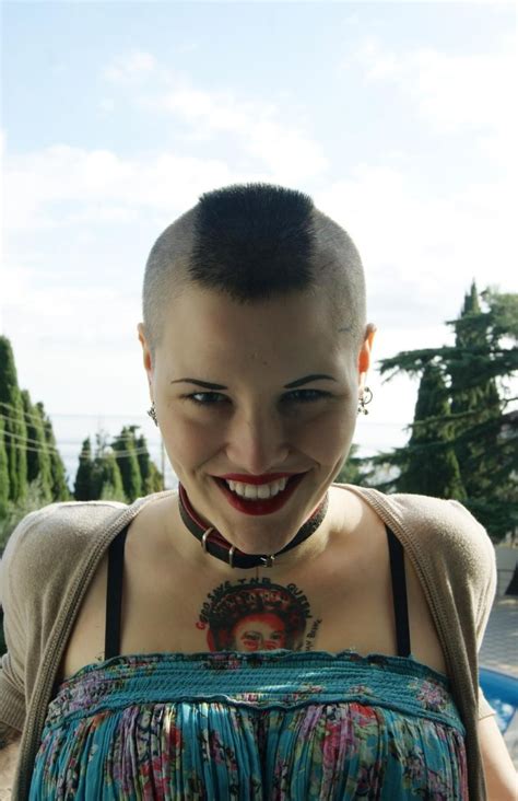 Young Woman With Shaved Sides And Mohawk Hair Eyebrowscut Buzzed