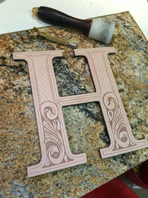 My very first attempt at leather carving.larger than actual size. Hand Tooled Leather Letters. | Handmade leather work
