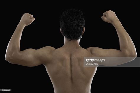 Muscular Man Flexing His Biceps High Res Stock Photo Getty Images