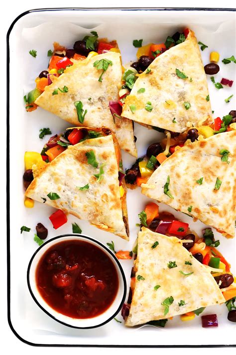 Zesty chicken and cooked peppers are a tasty delight when mixed with cheese and stuffed in a tortilla to create chicken quesadillas. Easy Veggie Quesadillas Recipe | Gimme Some Oven