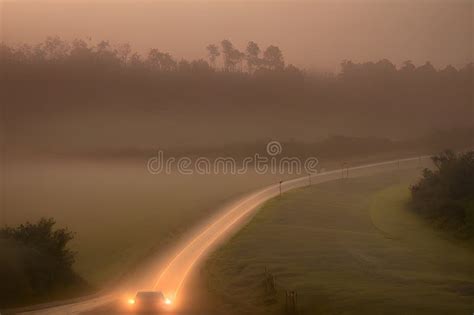 Image Of An Early Morning Elevated Shot Of A Dirt Road Winding Through