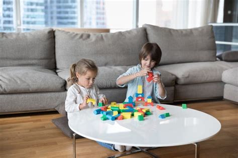 Two Preschool Sibling Kids Playing Game For Skills Development Stock