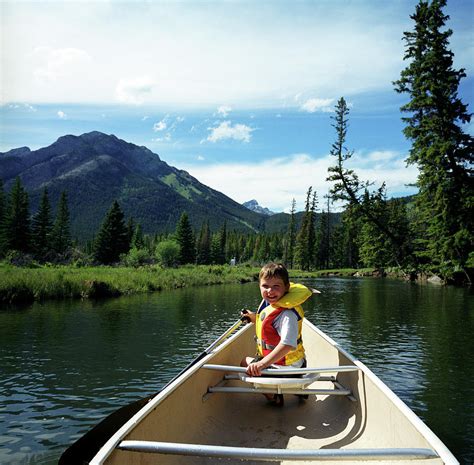 A Young Boy Explores The Bow River Photograph By Todd Korol Fine Art