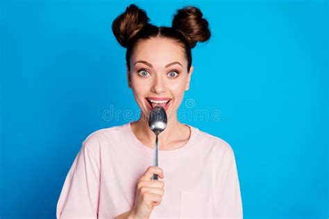 Photo Of Pretty Lovely Satisfied Lady Two Funny Buns Metal Spoon Inside