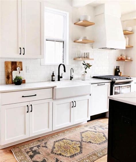 In some instances, sticking with plain vanilla can be equally stunning. white cabinets with black hardware | Home decor, White ...