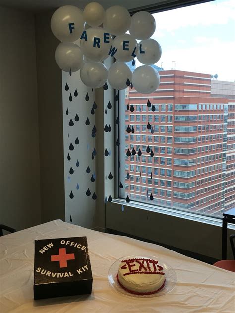 A Table With A Cake And Balloons In Front Of A Window