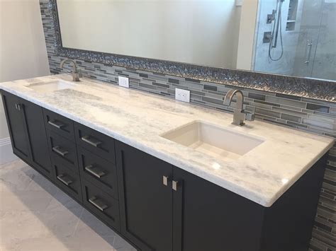 White Granite Double Vanity Sink With Modern Black Cabinets And Large