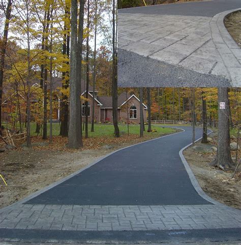 New Asphalt Driveway With A Stamped Concrete Apron And Border