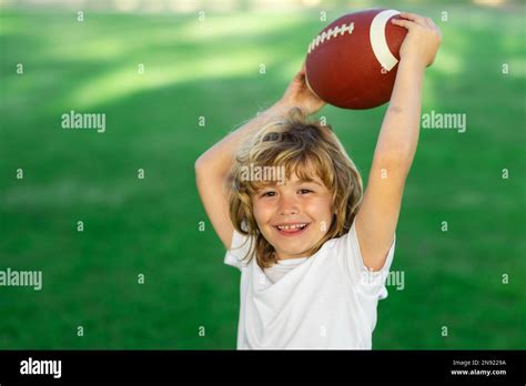 American Style Football Kids And Sports Young Boy Playing American