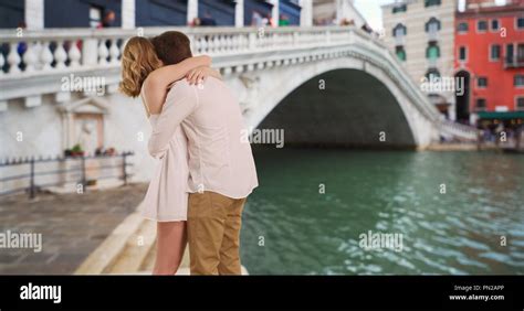 Young Married Couple By Rialto Bridge In Venice Italy Hugging Stock