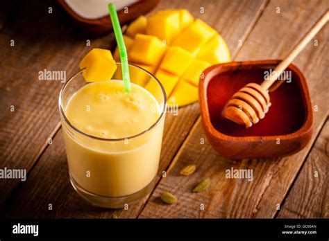 Glass Of Mango Lassi Indian Drink Made From Yogurt With Blended Mango